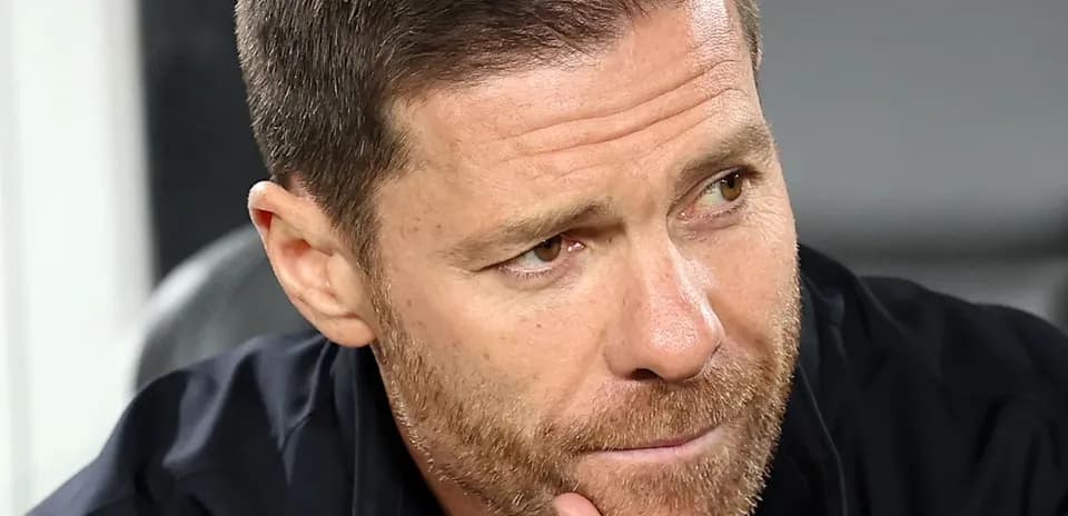 Close-up of a coach deep in thought