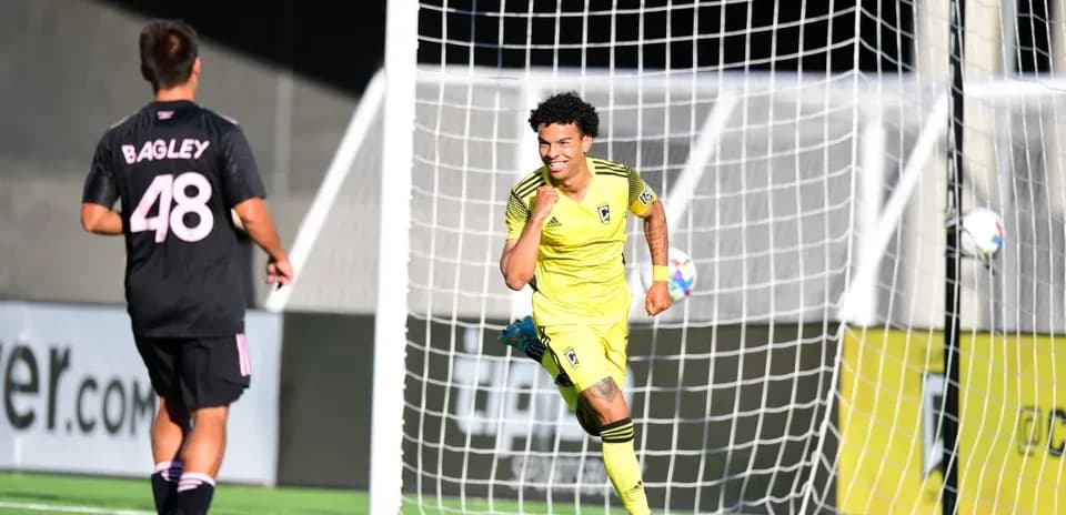 Goalkeeper celebrating after scoring a goal