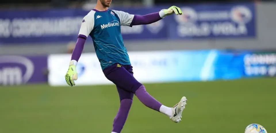 Goalkeeper practicing kick on training field