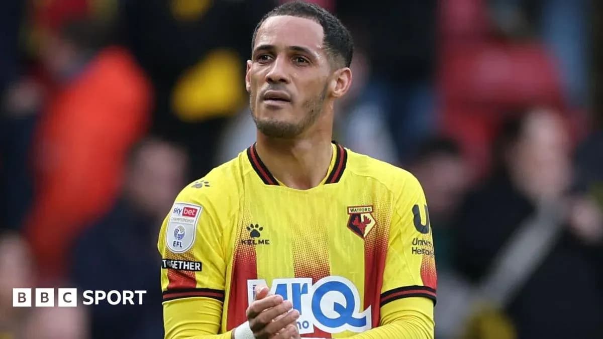 Watford player applauding fans after match