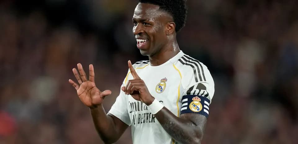Player celebrating with a hand gesture on field