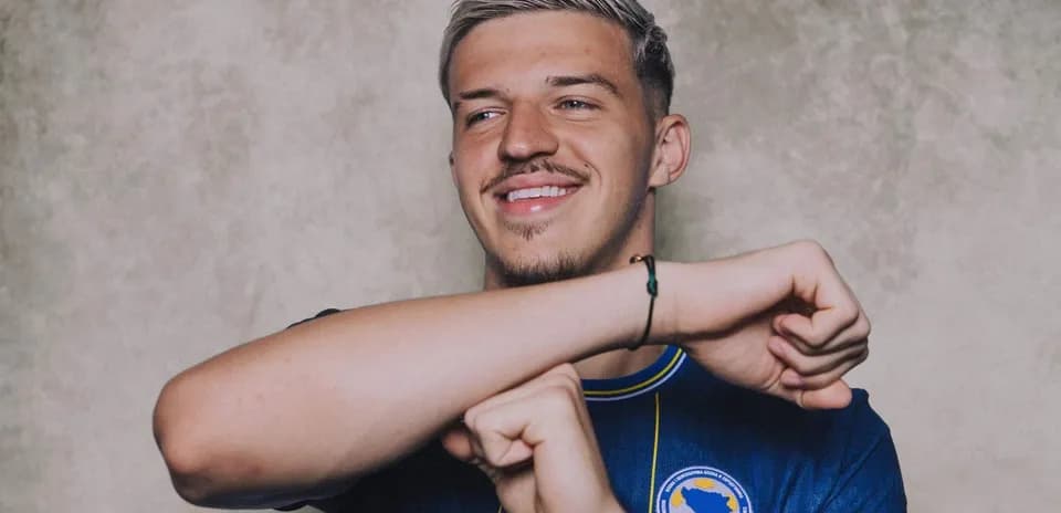Player smiling while wearing team jersey