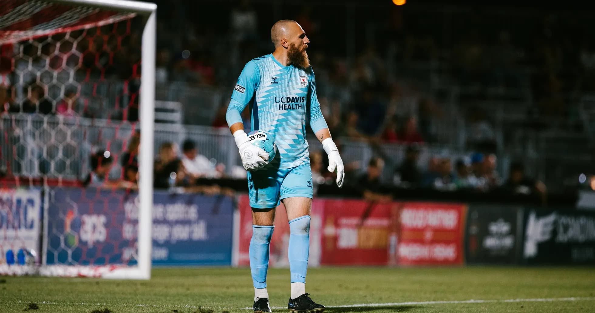 Goalkeeper holding ball during USL Championship match