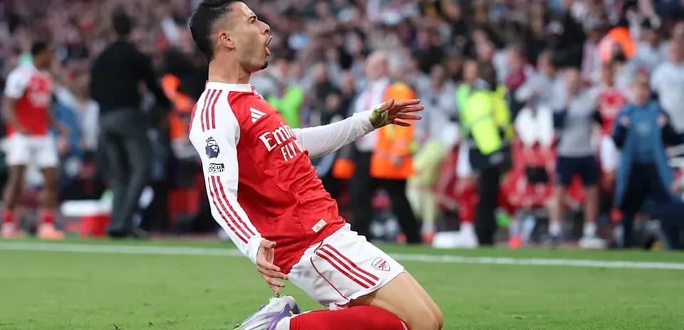 Player celebrating after scoring a goal on field