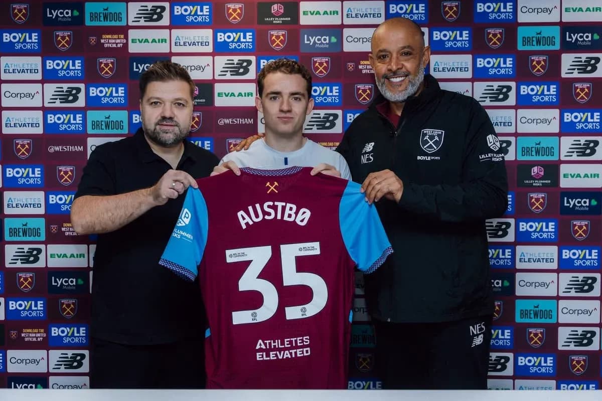 Player holding jersey with 'AUSTBØ 35' at signing event