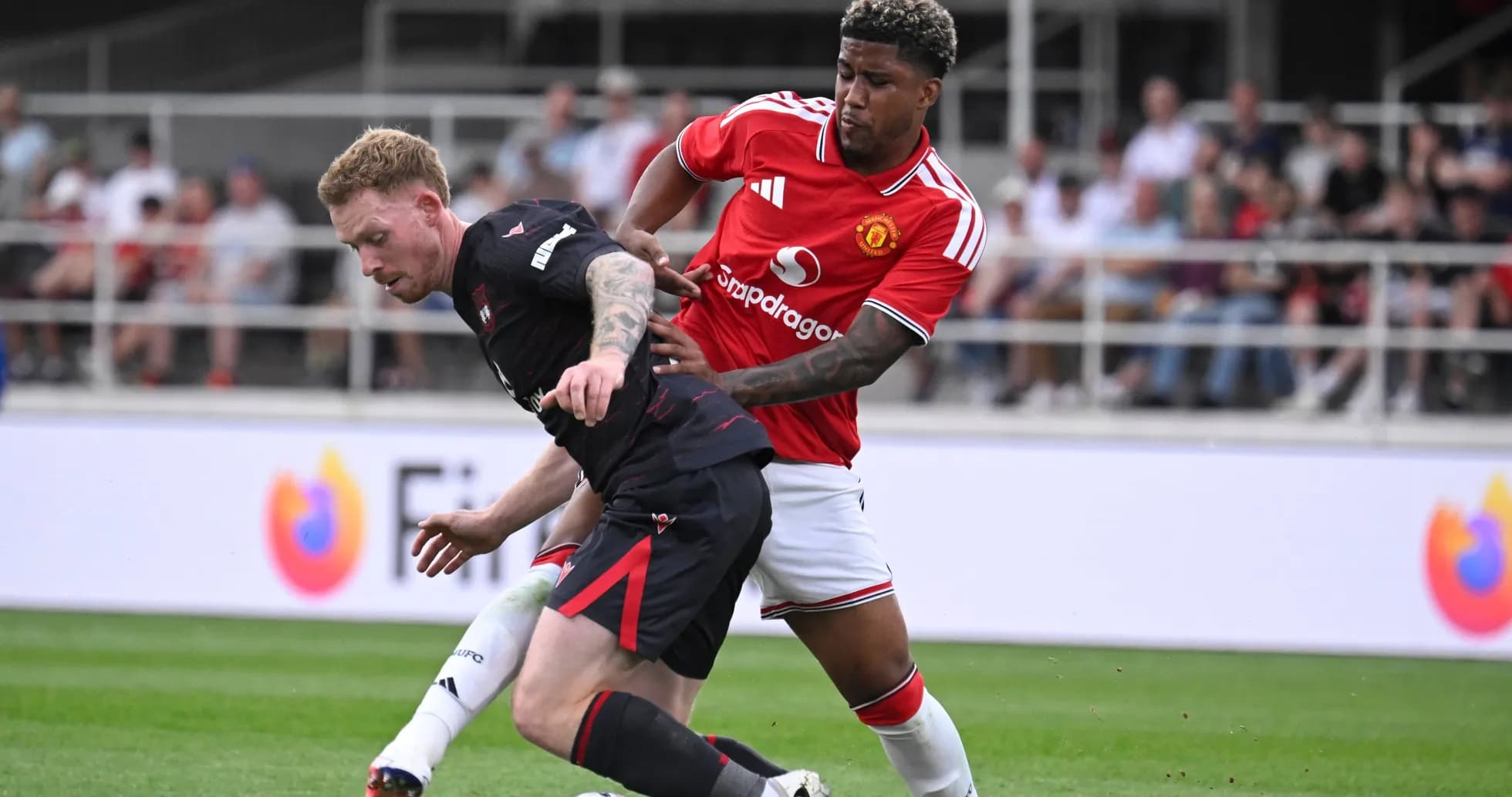 Player tackling opponent during a football match