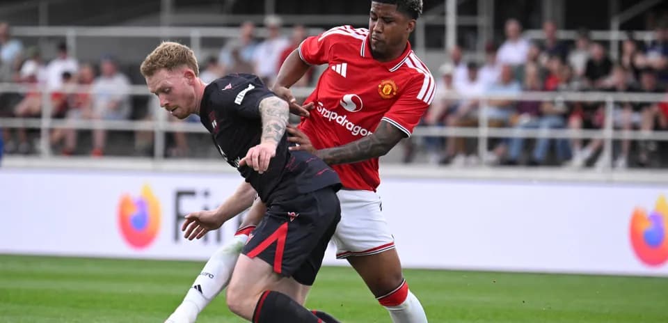 Player tackling opponent during a football match