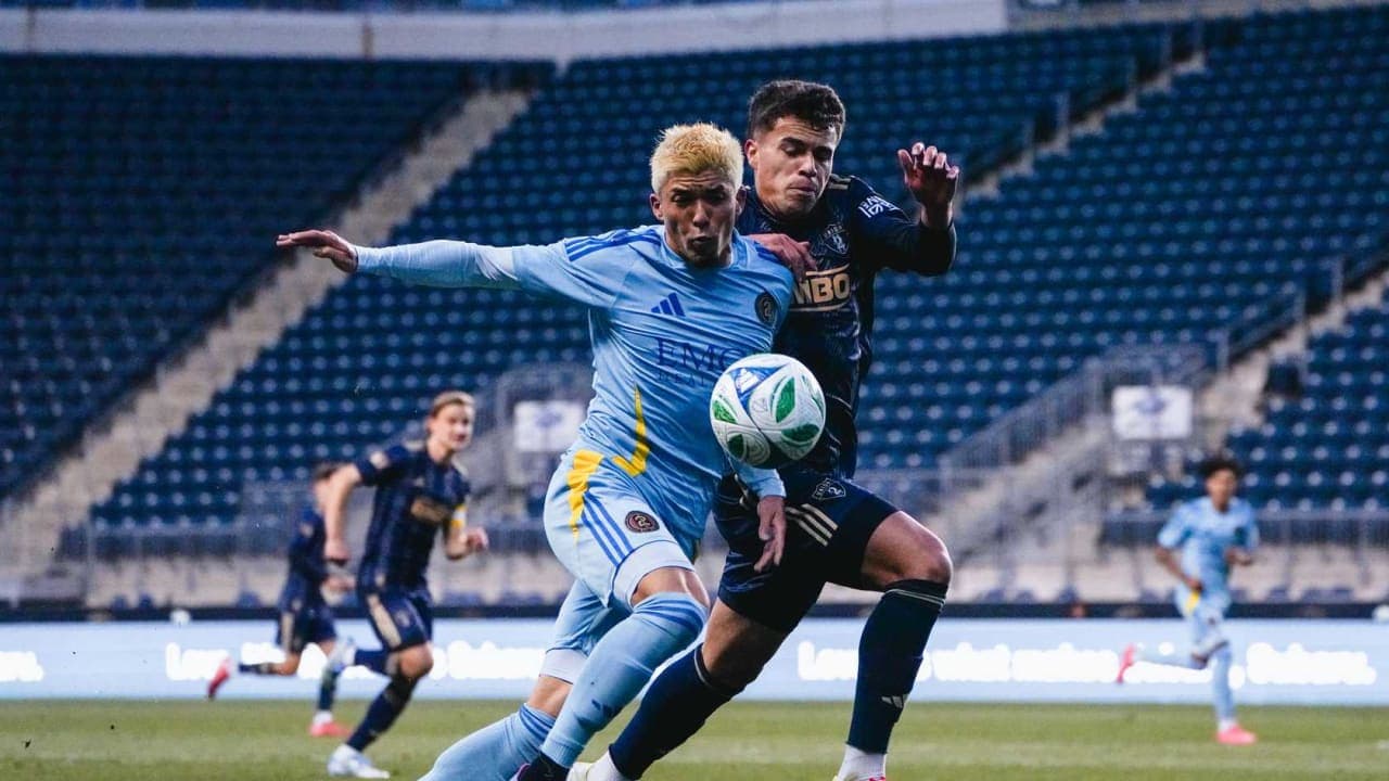 Players competing for the ball during match