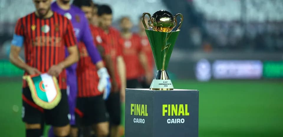 Teams entering field with trophy for final match