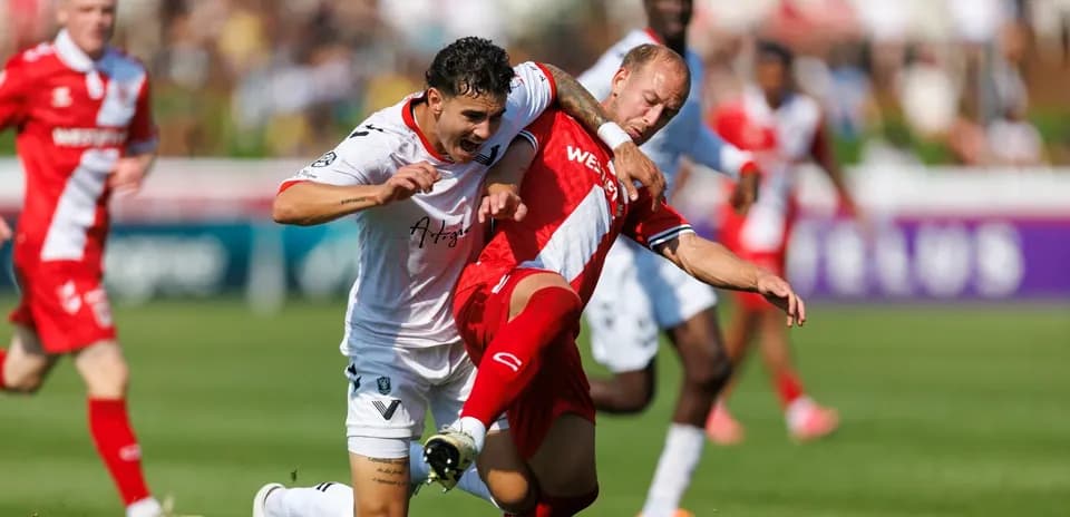 Players contesting for the ball during match