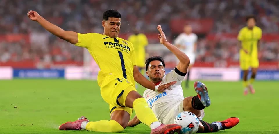Villarreal and Sevilla players battling for the ball