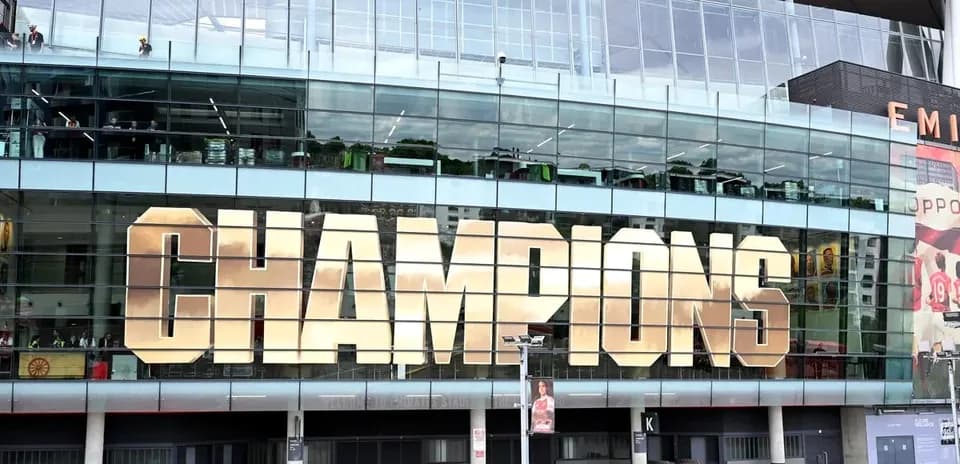 Champions sign displayed on stadium facade