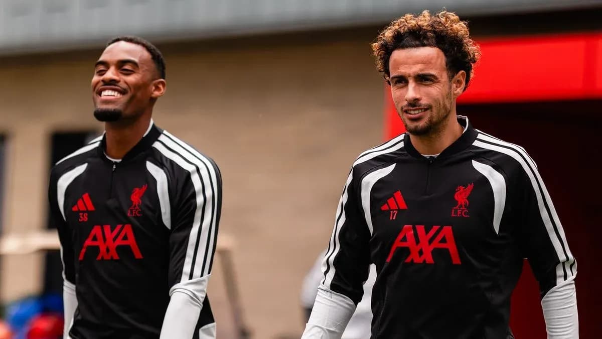 Two Liverpool players walking during training session