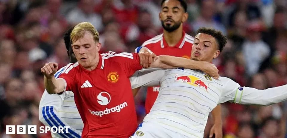 Players challenging for the ball during match action