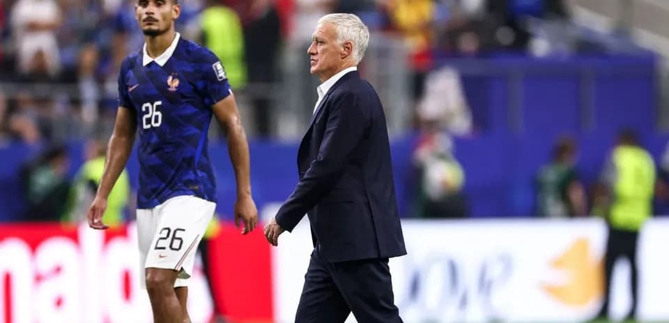 France coach Didier Deschamps walking past player 26