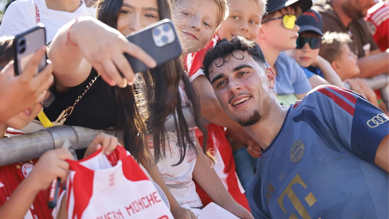Player taking selfie with fans after match Player taking selfie with fans after match