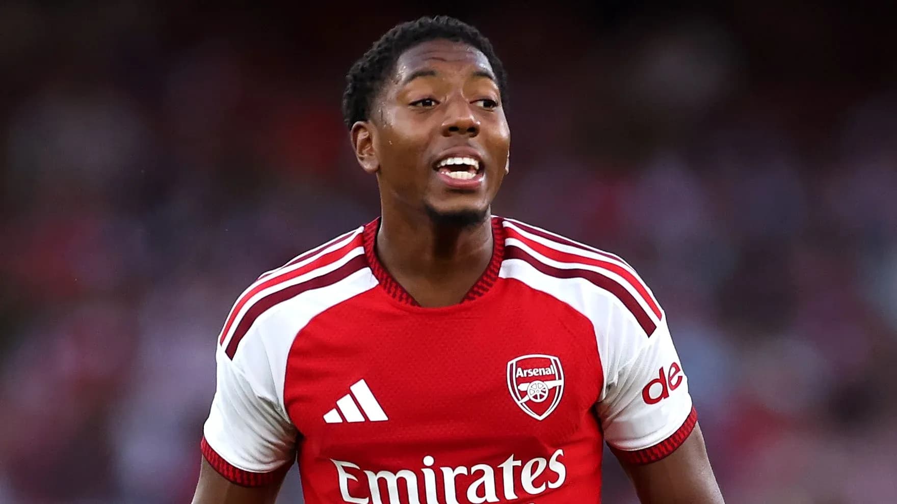 Player celebrating during an Arsenal match Player celebrating during an Arsenal match