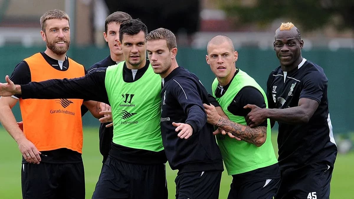 Liverpool players training and interacting on the pitch Liverpool players training and interacting on the pitch