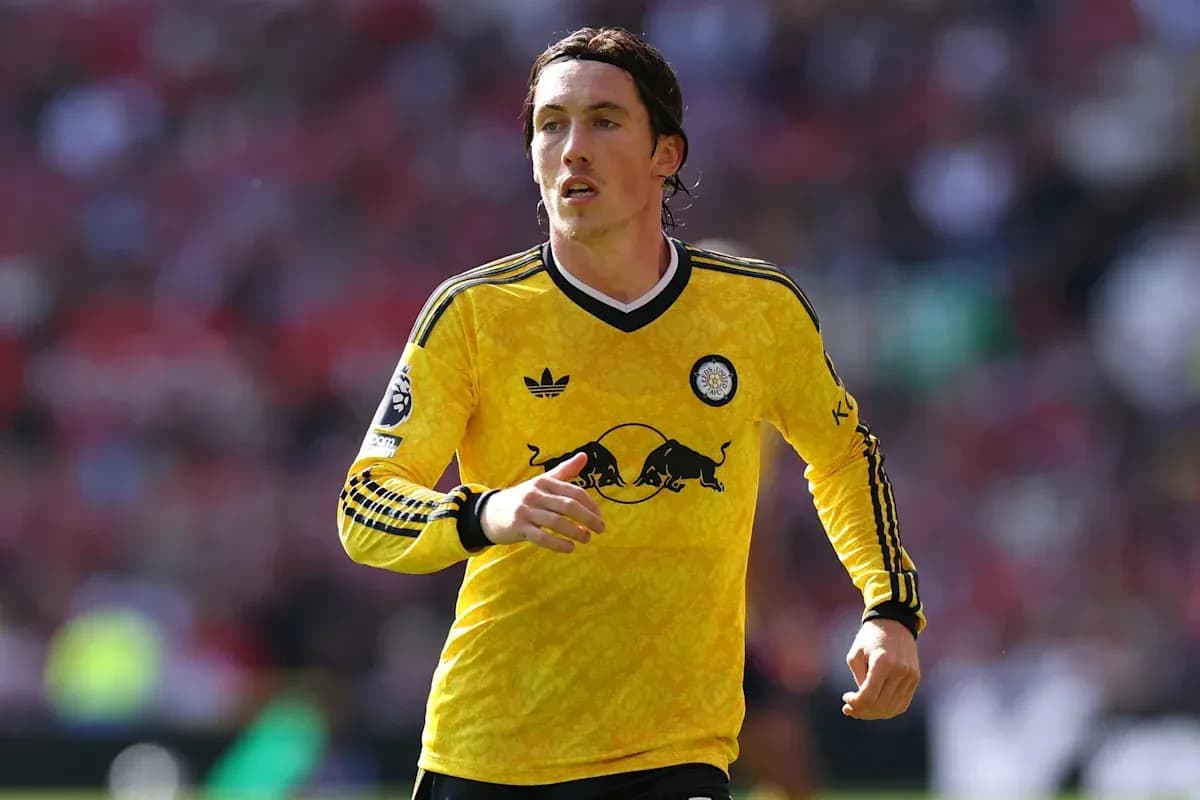 Player wearing yellow jersey running on the field Player wearing yellow jersey running on the field