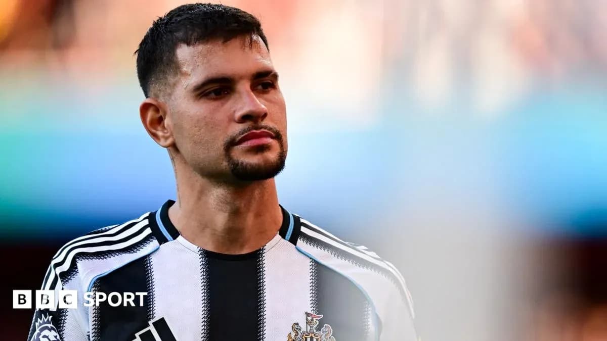 Newcastle player in black and white jersey Newcastle player in black and white jersey