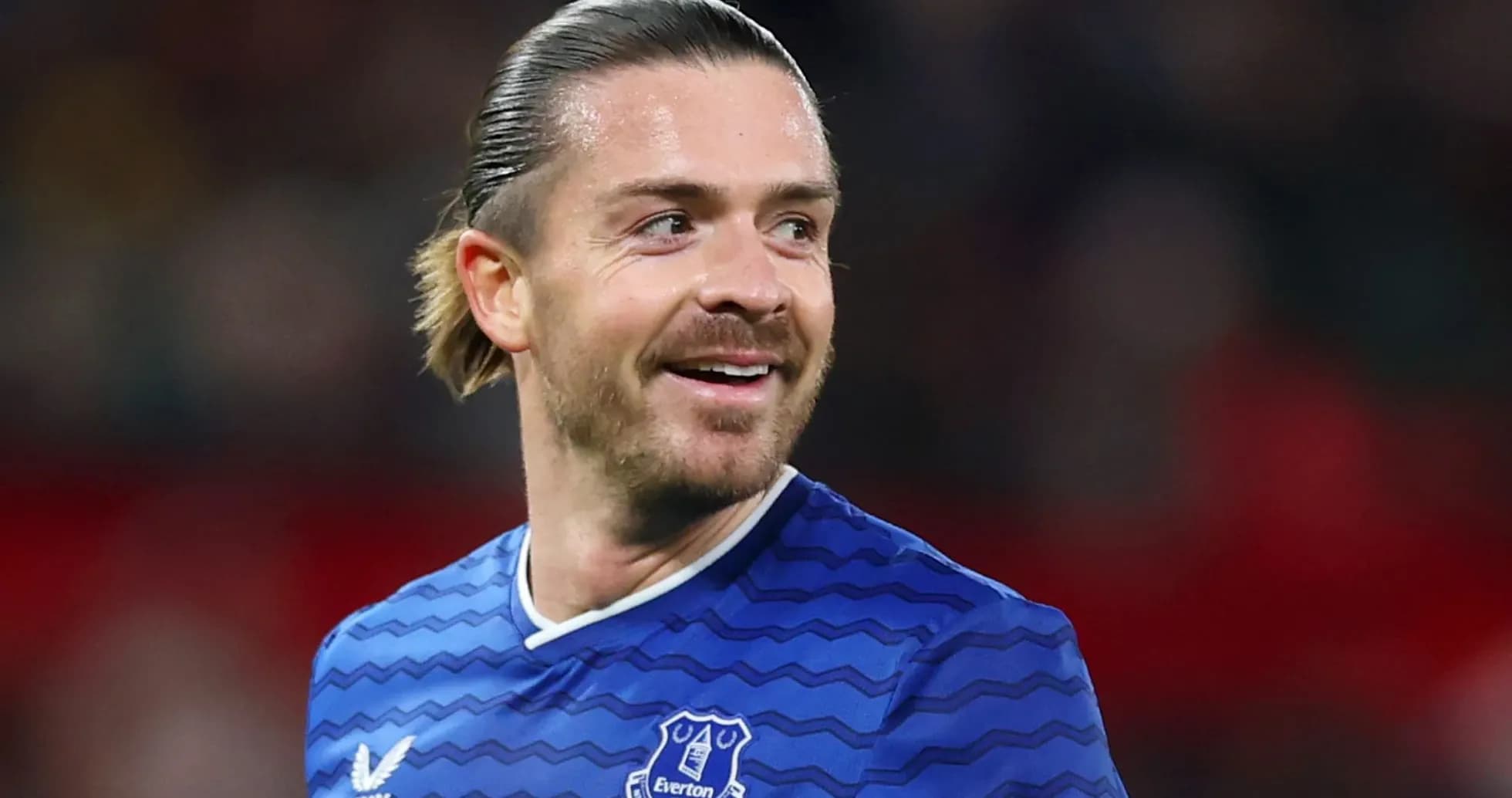 Player smiling in Everton football kit Player smiling in Everton football kit