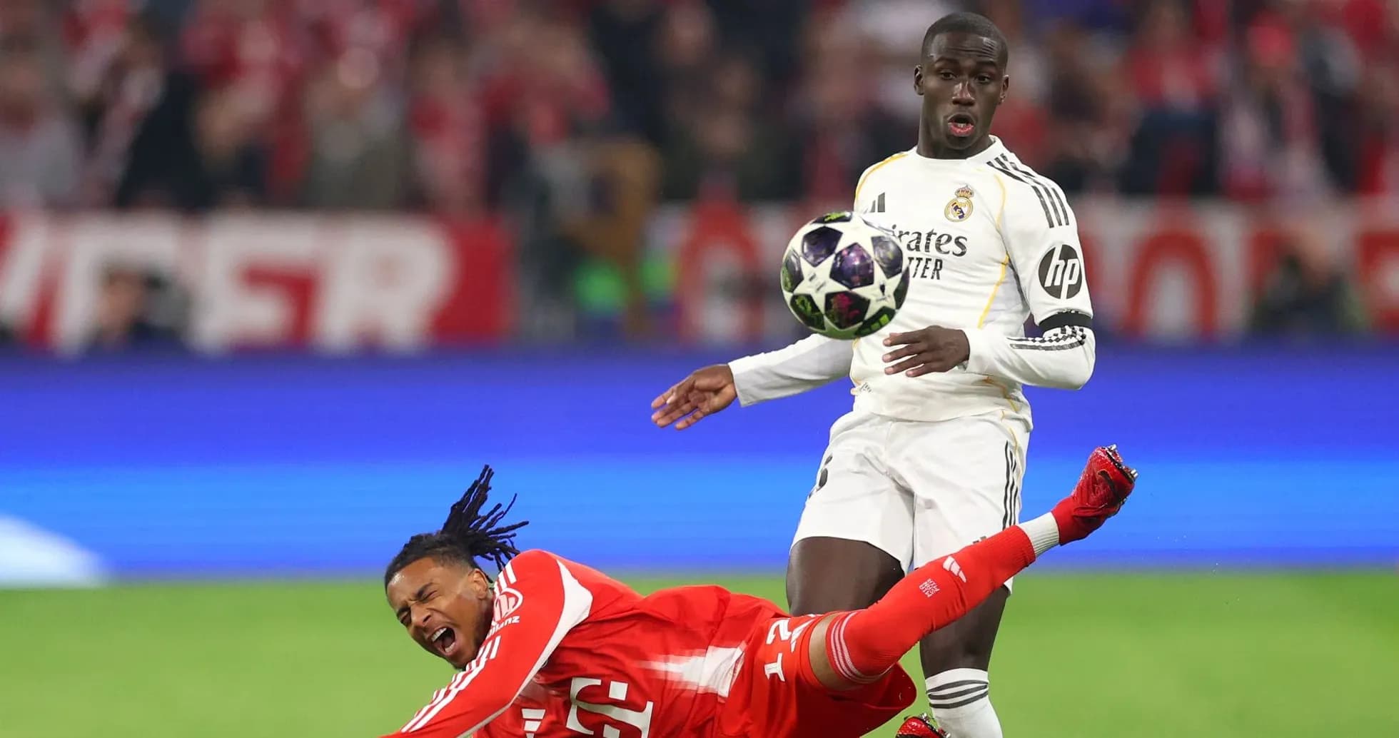 Player falling while opposing player dribbles ball Player falling while opposing player dribbles ball