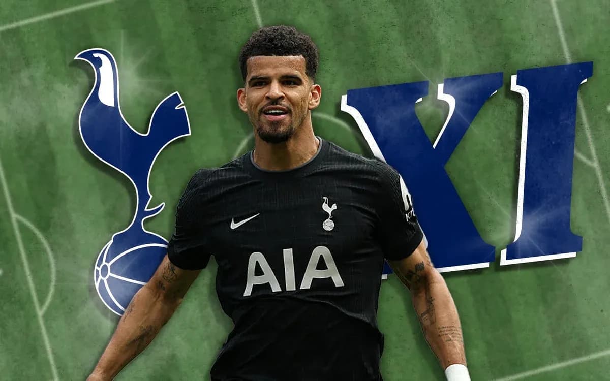 Player in Tottenham kit celebrating on football pitch Player in Tottenham kit celebrating on football pitch