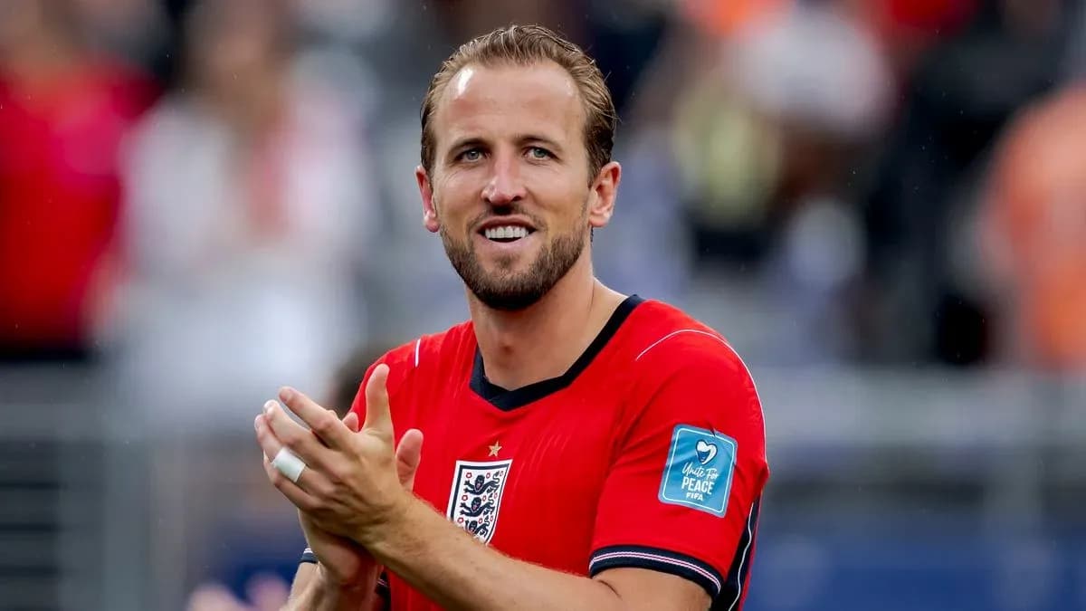 Player applauding wearing red jersey during match Player applauding wearing red jersey during match