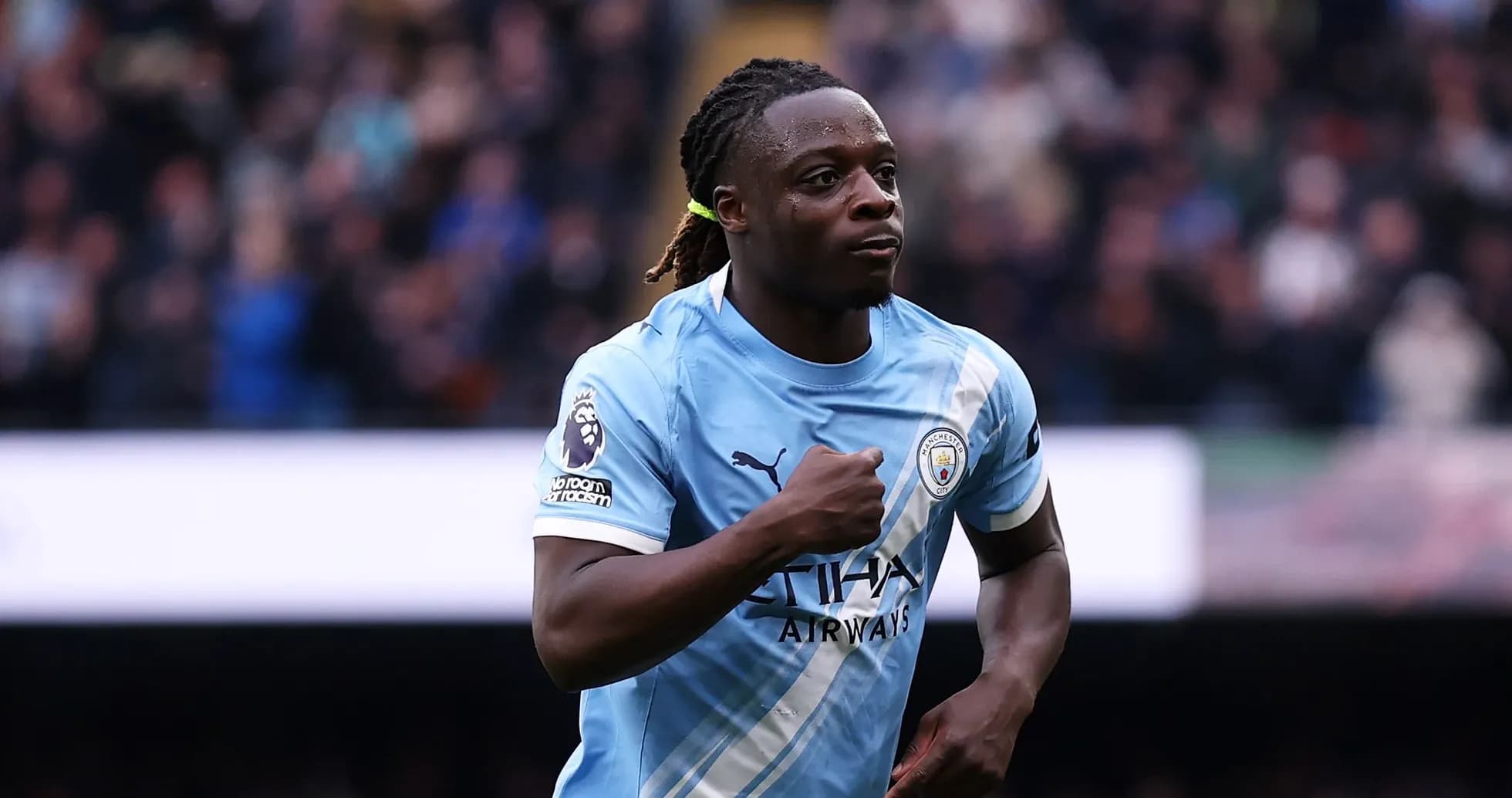 Player celebrating after scoring a goal for Manchester City Player celebrating after scoring a goal for Manchester City