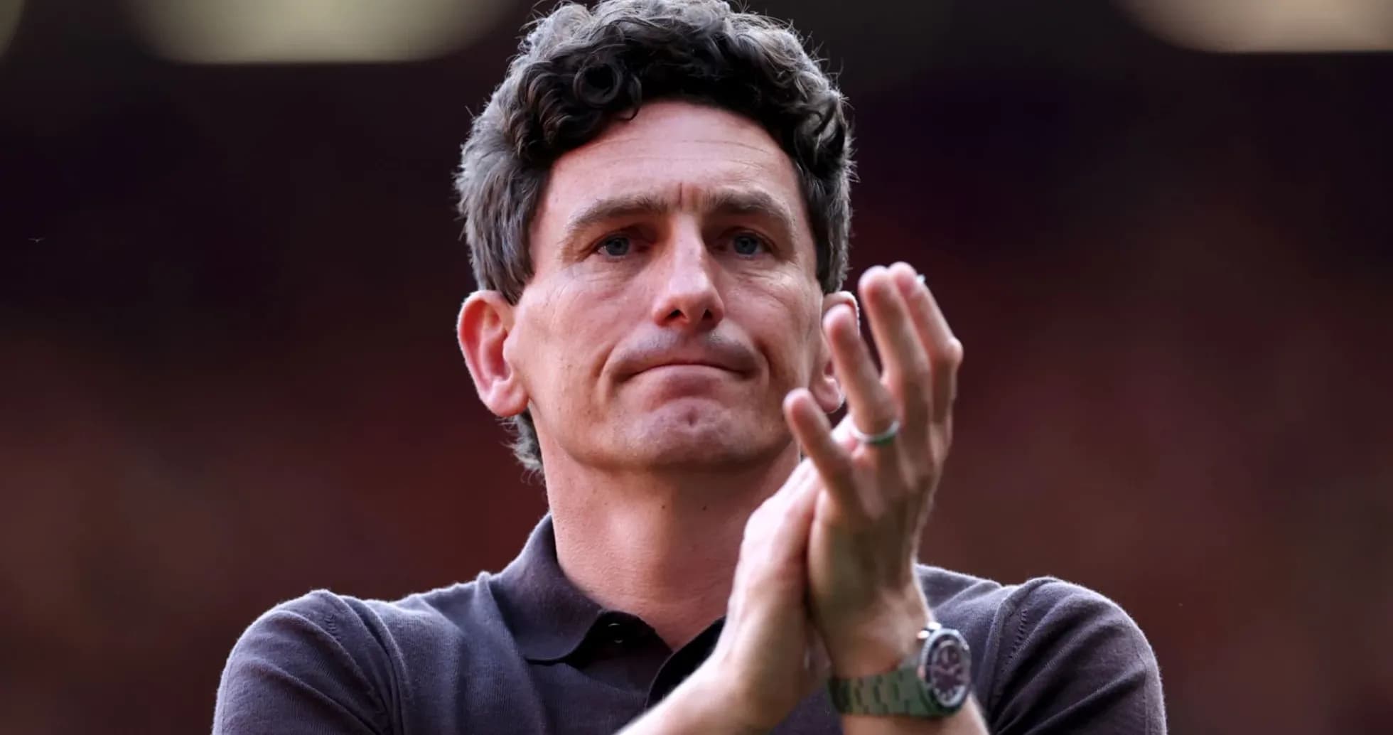 Coach applauding during match at stadium Coach applauding during match at stadium