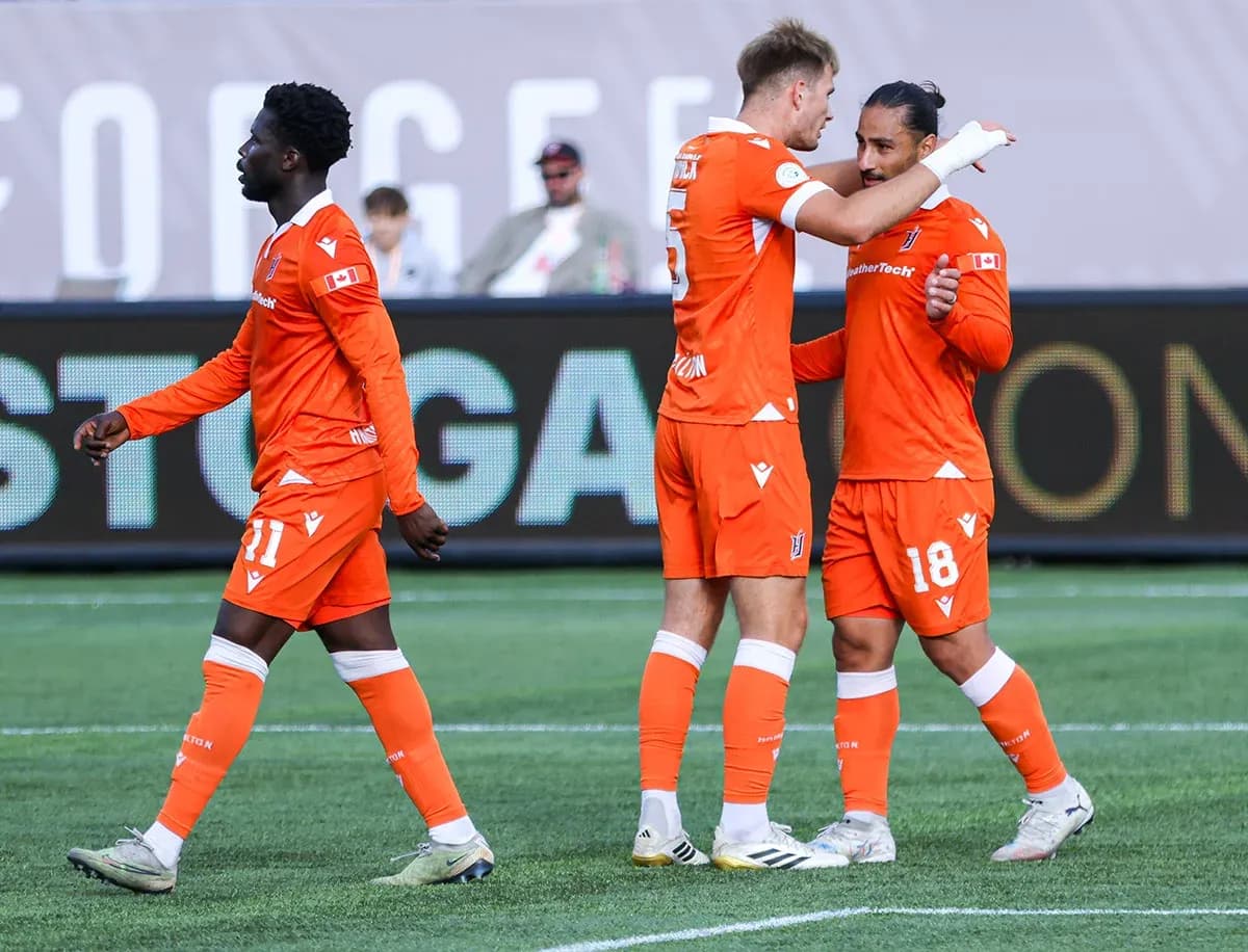 Forge FC players celebrating a goal Forge FC players celebrating a goal