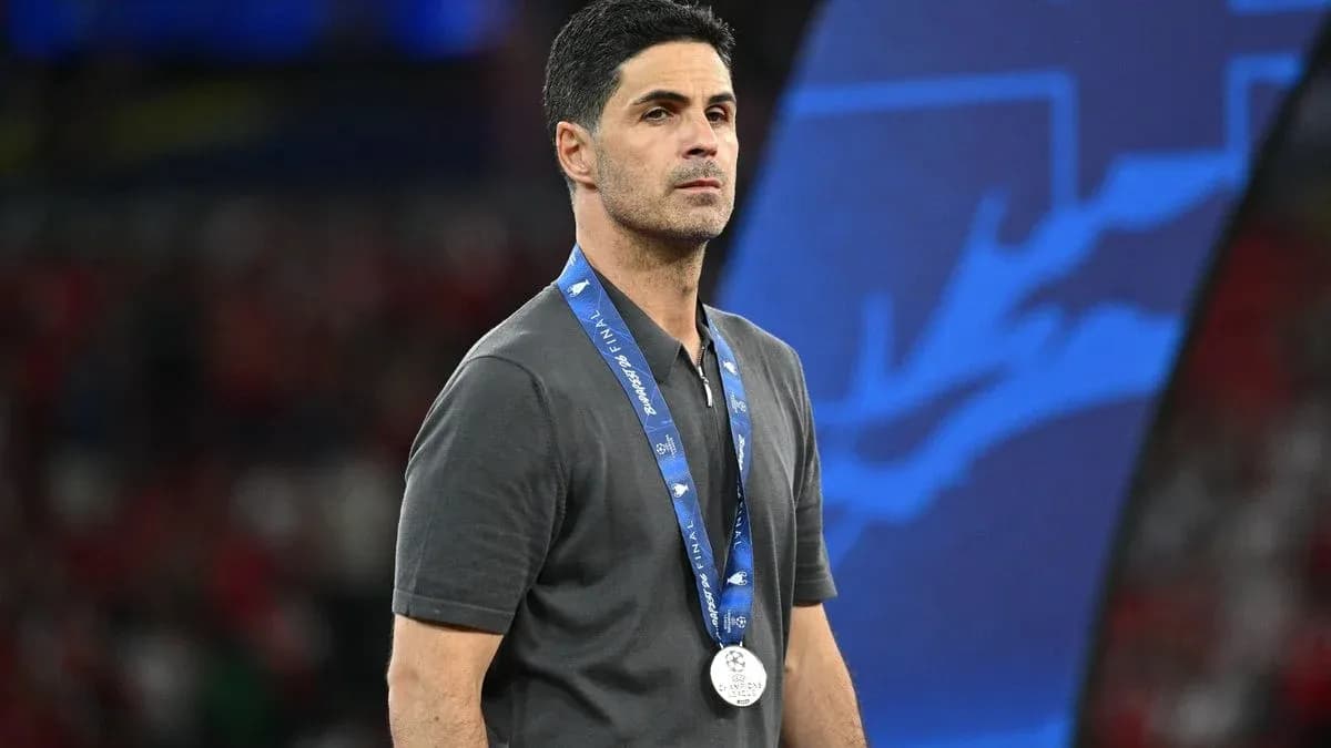 Coach wearing a silver medal at event Coach wearing a silver medal at event