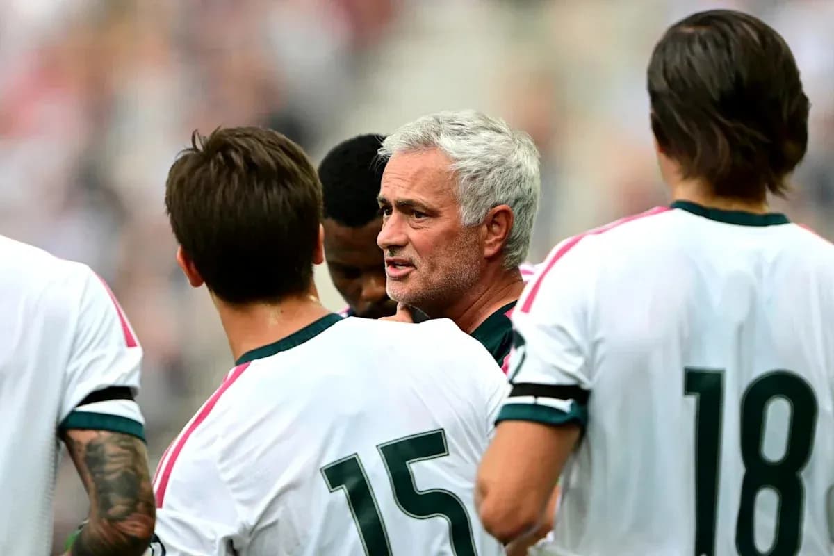 Manager discussing strategy with players during match Manager discussing strategy with players during match