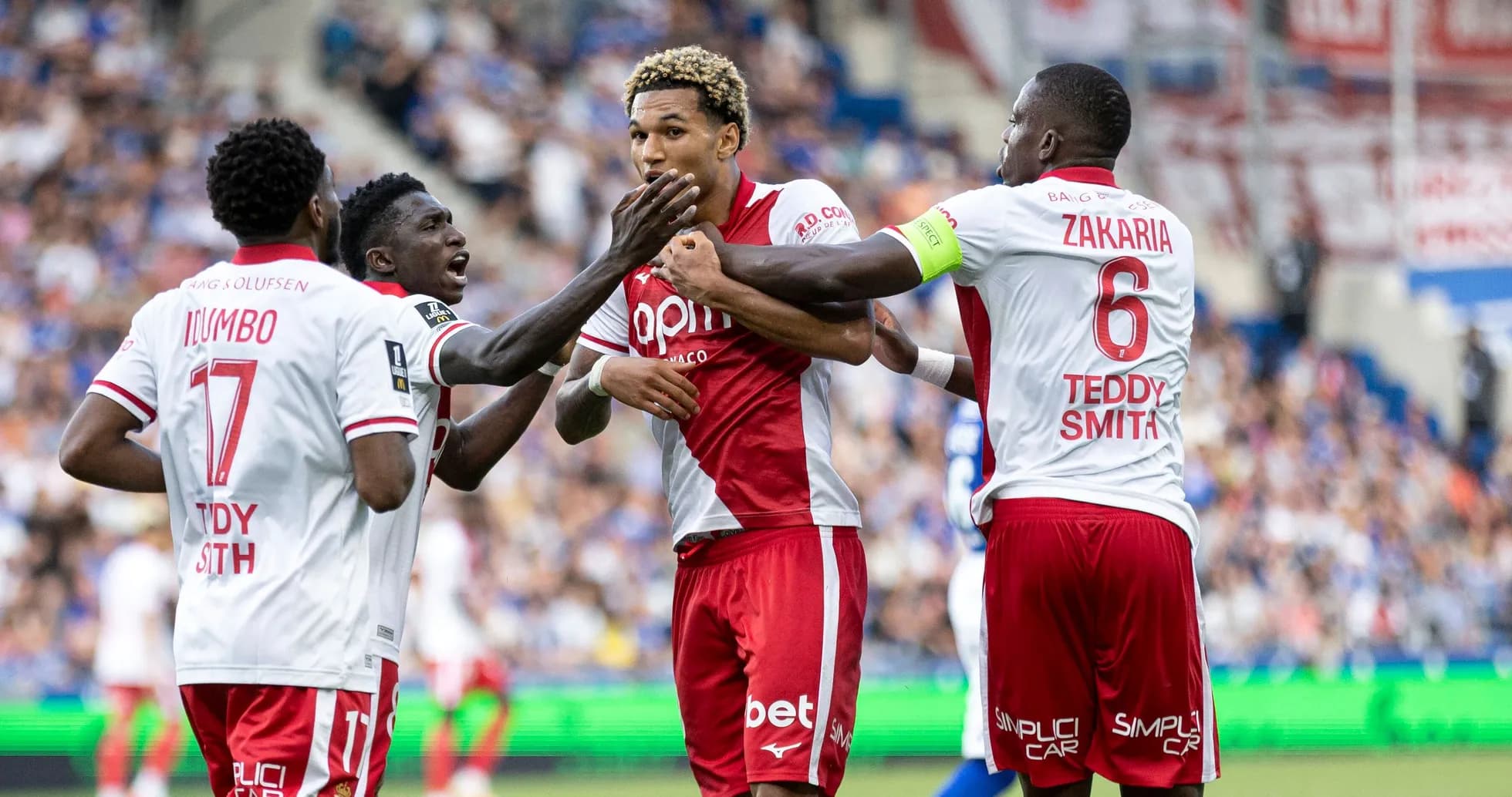 Players celebrating a goal during a match Players celebrating a goal during a match
