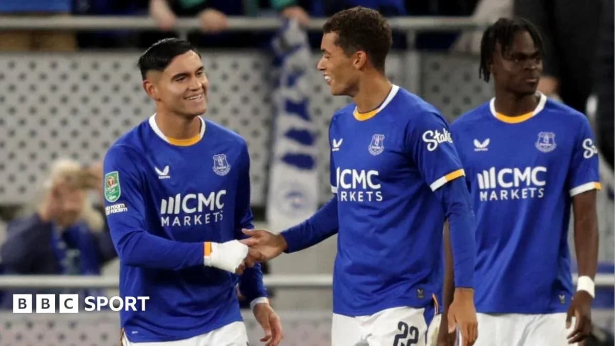 Everton players celebrating on the field after a match Everton players celebrating on the field after a match