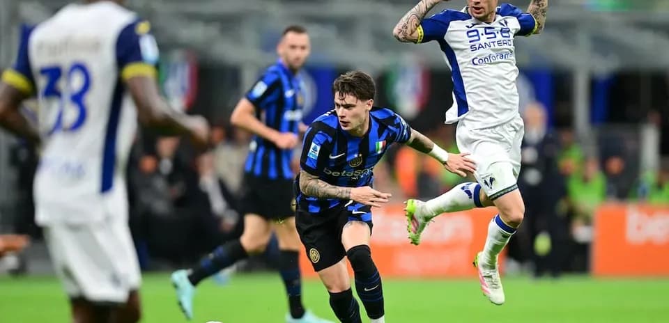 Inter player dribbling past Hellas Verona opponent Inter player dribbling past Hellas Verona opponent