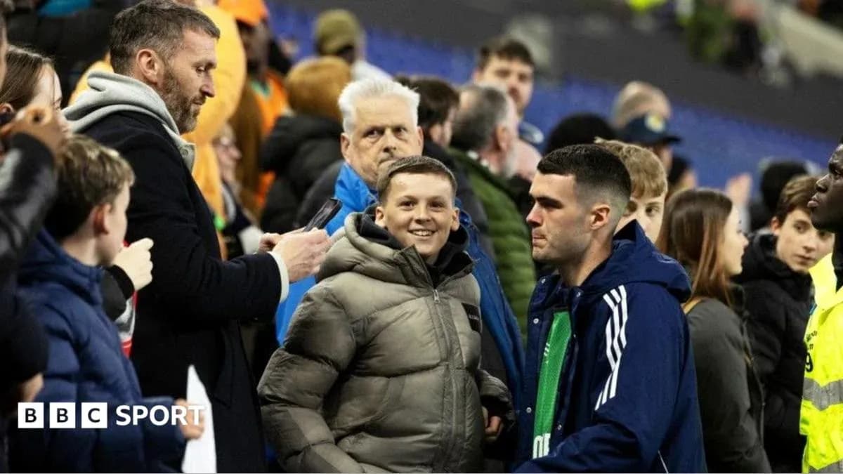 Fans interacting in the stadium stands after match Fans interacting in the stadium stands after match