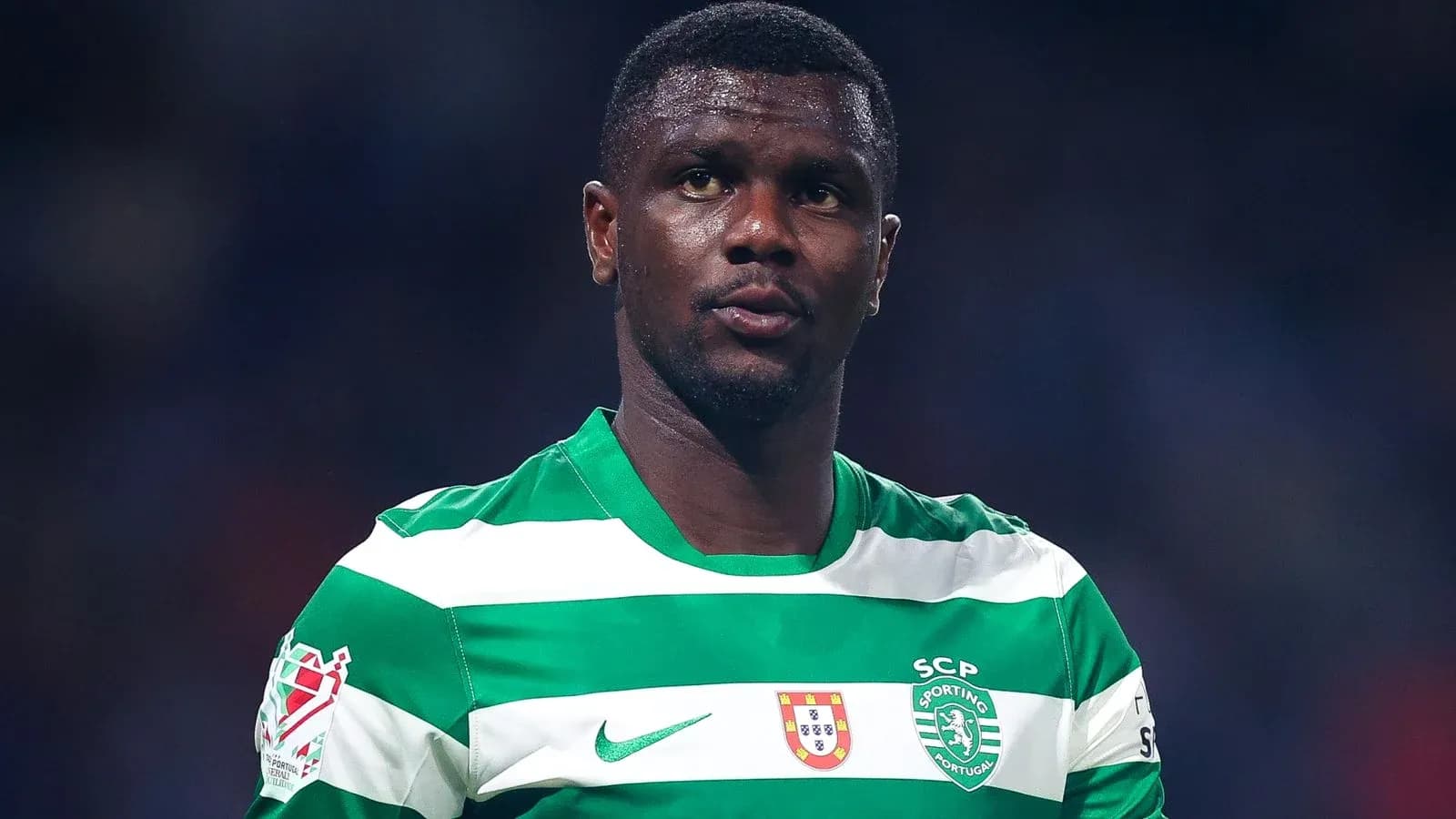 Player in green and white striped jersey during match Player in green and white striped jersey during match