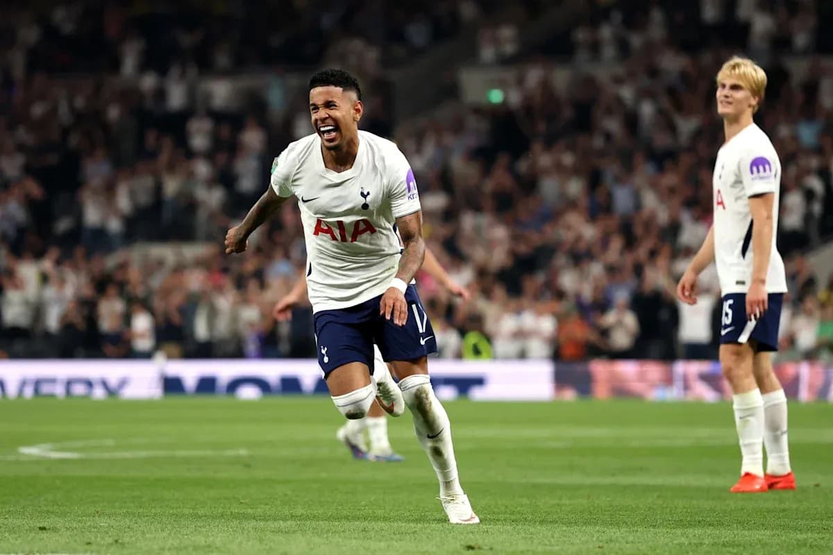 Tottenham player celebrating a goal on the pitch Tottenham player celebrating a goal on the pitch