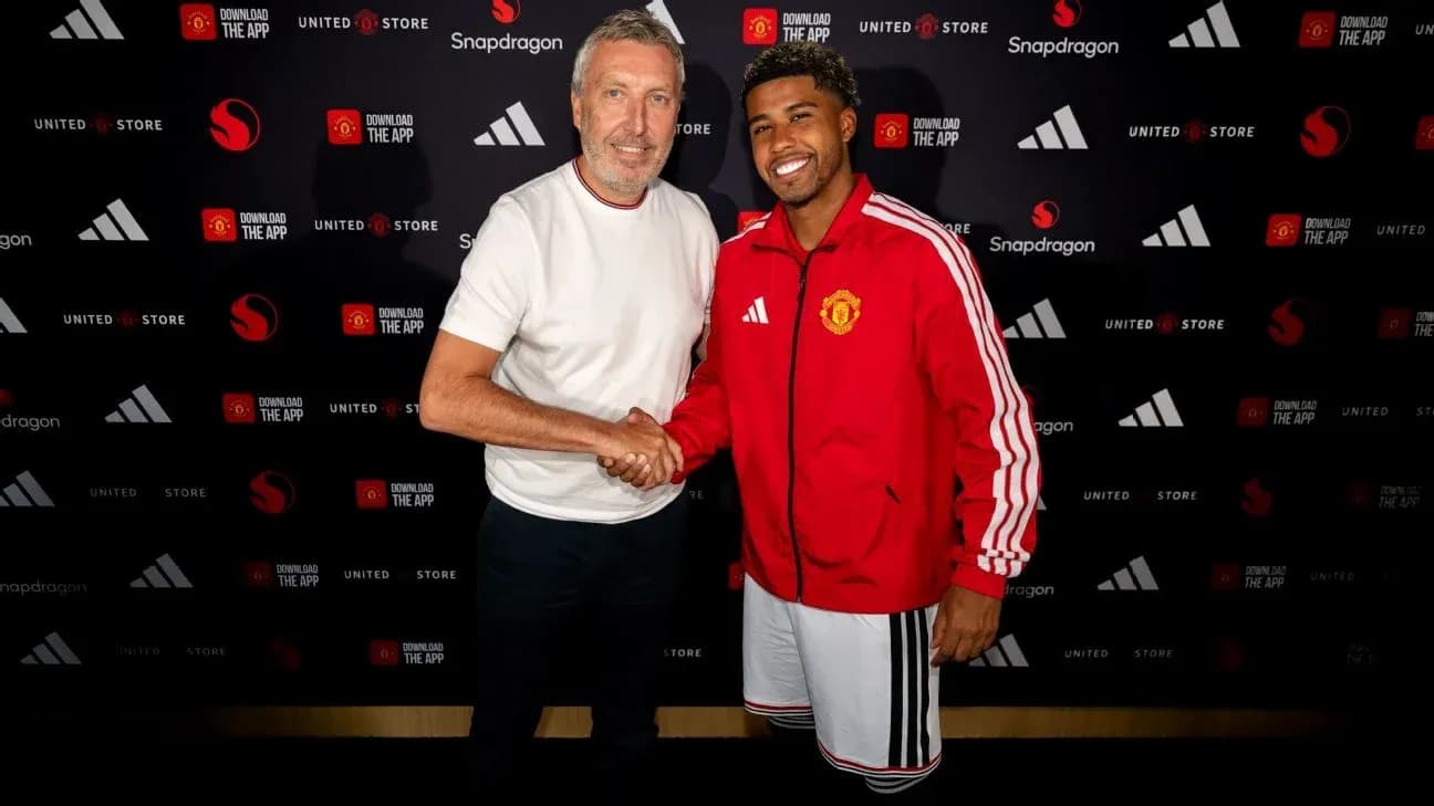 Two men shaking hands at Manchester United announcement Two men shaking hands at Manchester United announcement