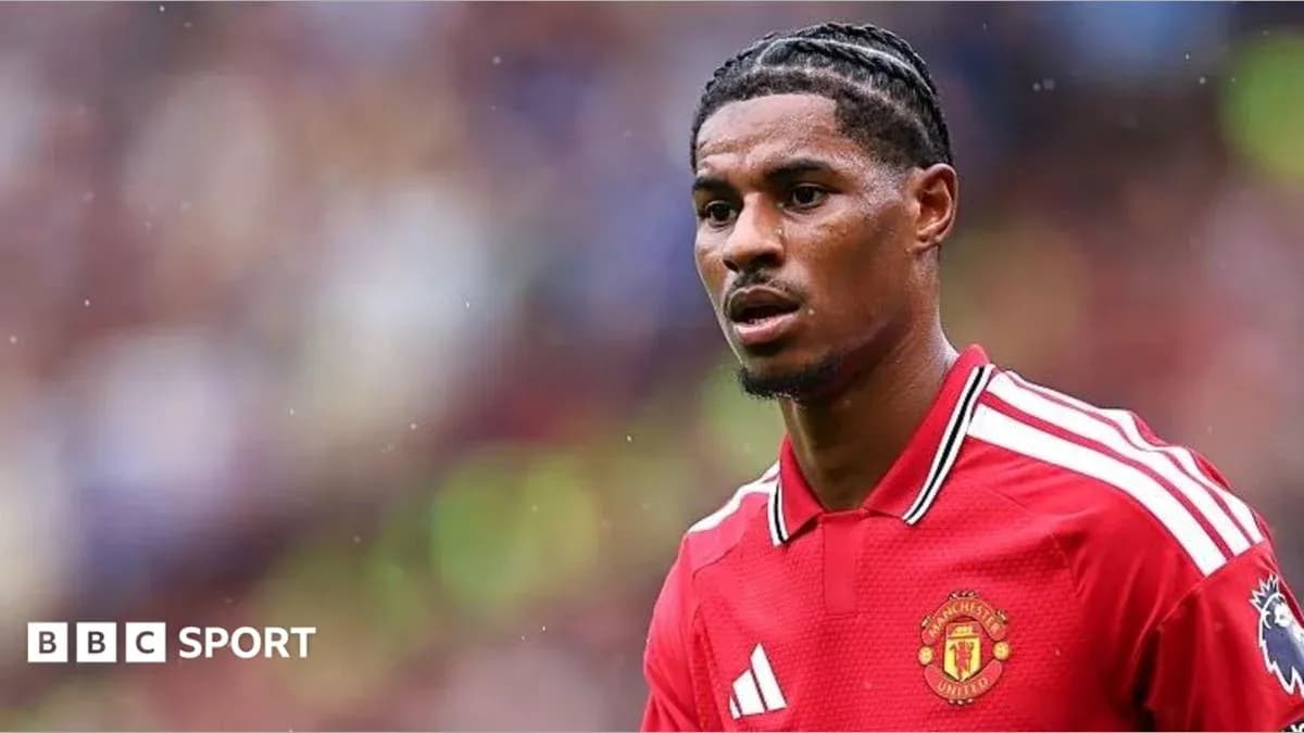 Player in Manchester United kit on the pitch Player in Manchester United kit on the pitch