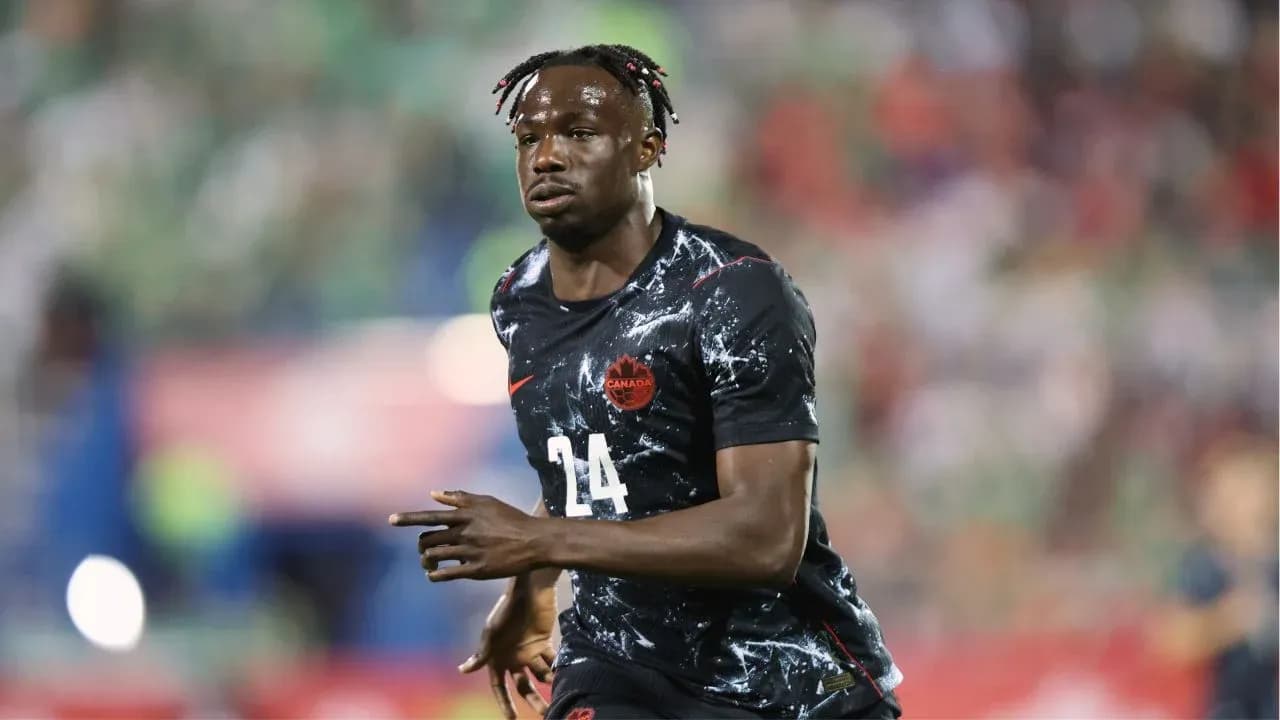 Player wearing Canada jersey running on field Player wearing Canada jersey running on field