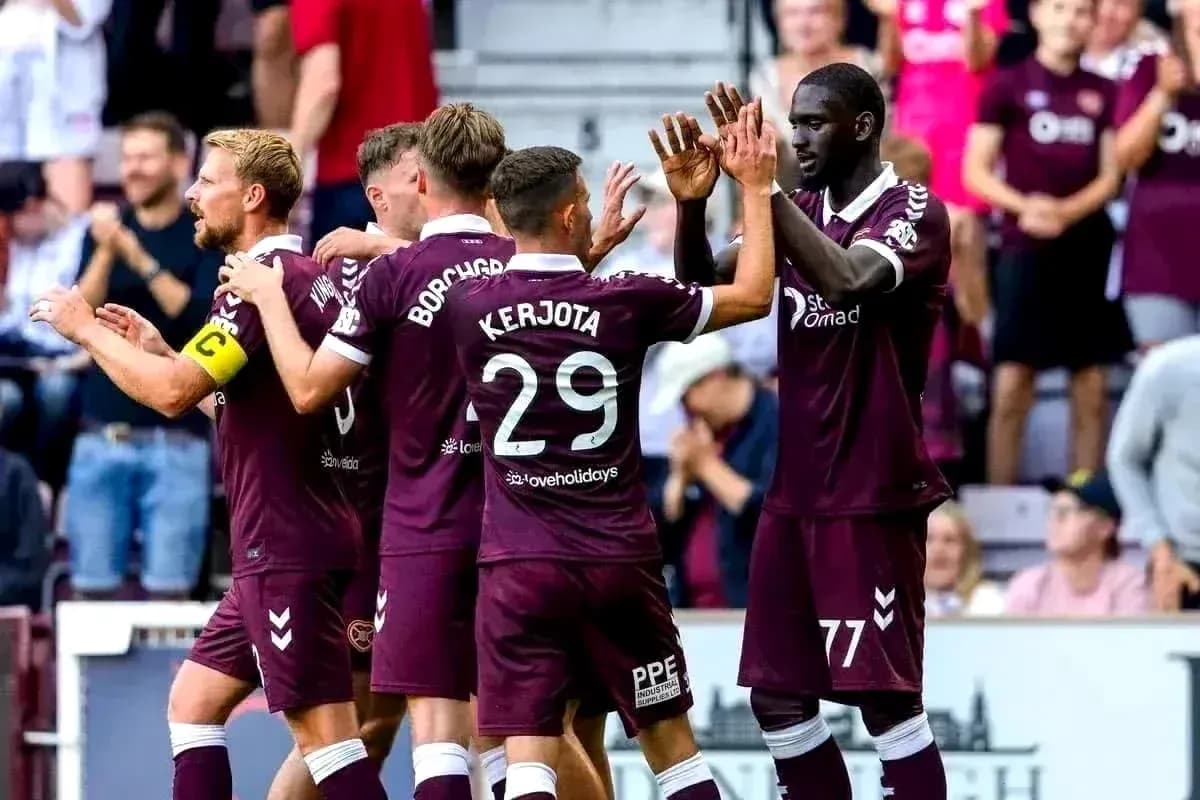 Hearts players celebrating a goal during match Hearts players celebrating a goal during match
