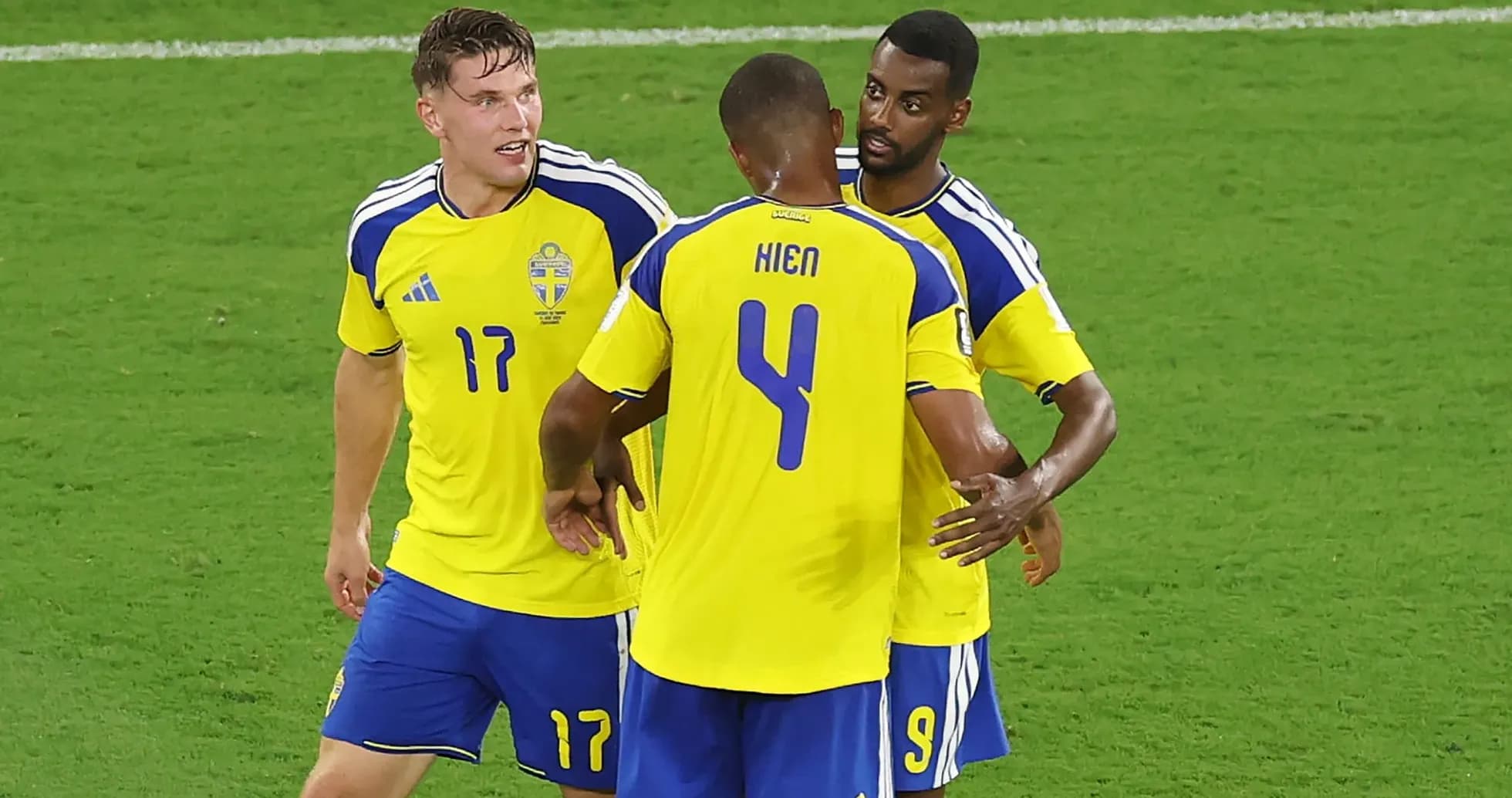 Swedish players celebrating a goal on the field Swedish players celebrating a goal on the field
