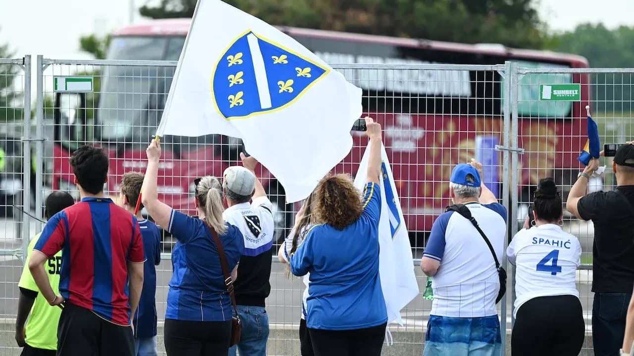 Bosnia and Herzegovina fans waving flag Bosnia and Herzegovina fans waving flag