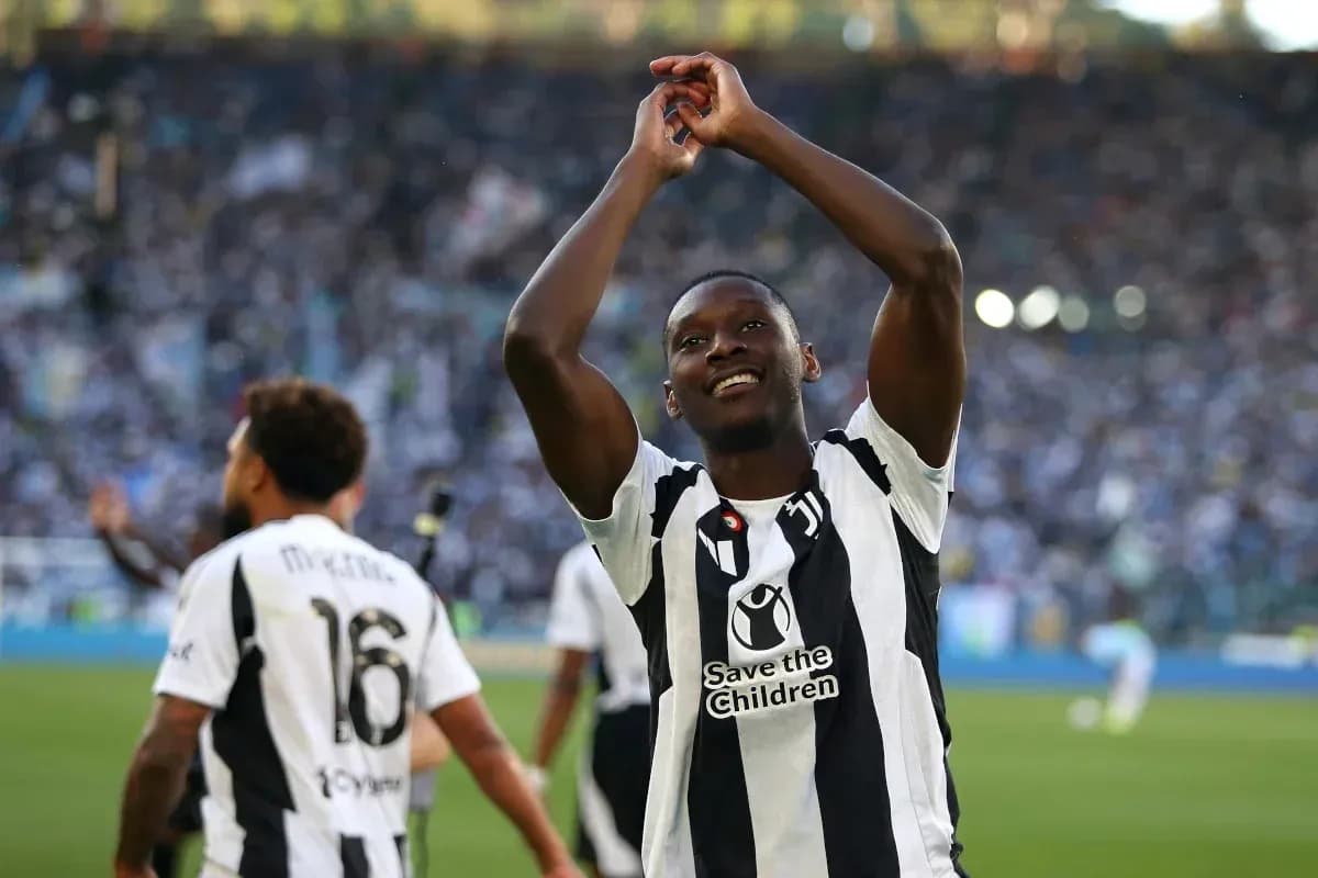 Player celebrating in front of cheering crowd Player celebrating in front of cheering crowd