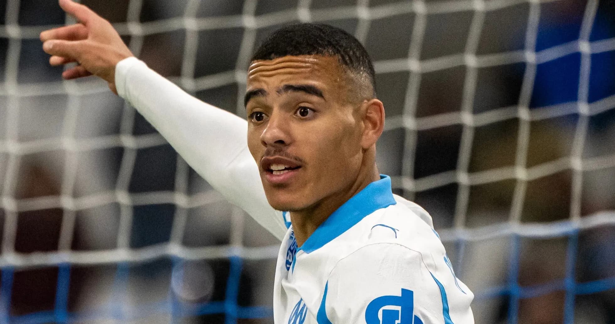 Player gesturing during a football match Player gesturing during a football match