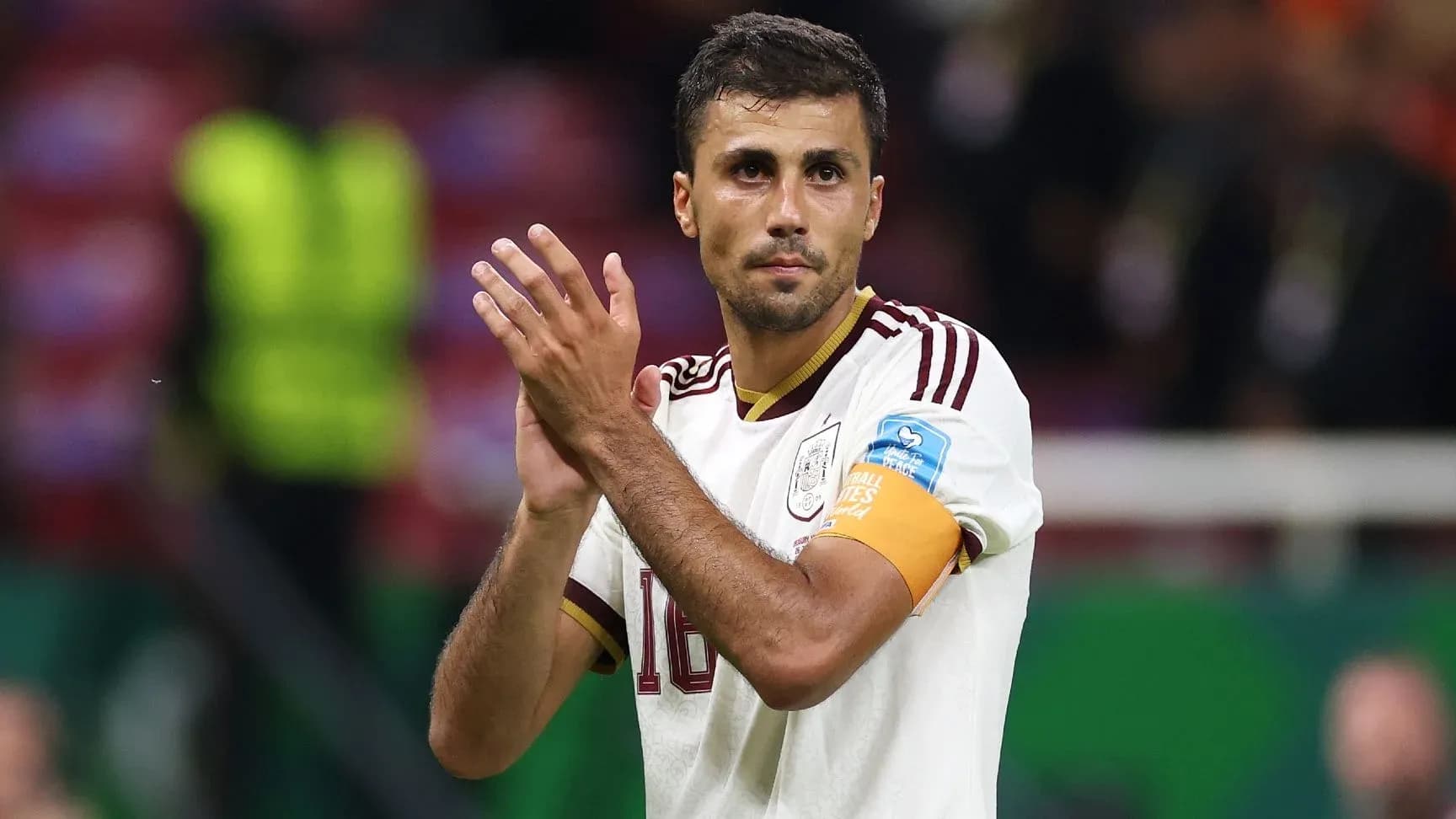 Player applauding fans after match wearing captain's armband Player applauding fans after match wearing captain's armband