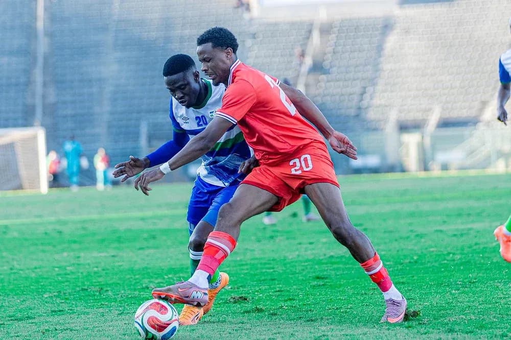 Two players contesting for the ball during match Two players contesting for the ball during match