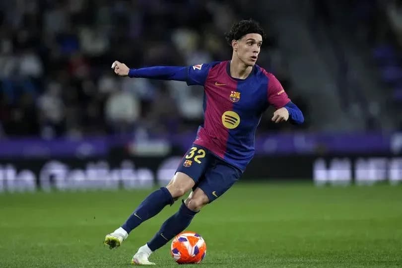 Player in Barcelona kit dribbling the ball Player in Barcelona kit dribbling the ball